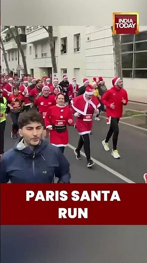 Thousands of Santas Take to the Streets in Paris for Annual Festive Santa Run
