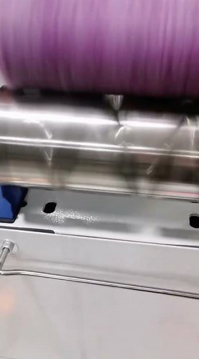 The process of winding a yarn using a large advanced machine