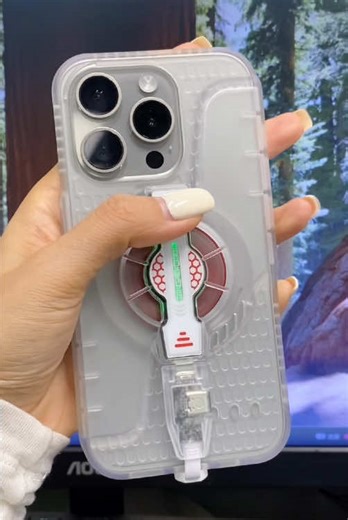 For all the streamers out there! 📱✨ Keep your iPhone cool and your live stream smooth. This sleek case has a built-in fan, allows charging while cooling, and looks super futuristic. Never miss a moment due to overheating. #LiveStream #iPhoneAccessories #TechGadgets #contentcreator