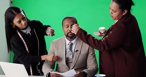 Man, news reporter and makeup artist with green screen for broadcast with wardrobe