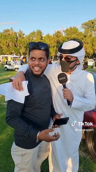 Car Enthusiasts Discuss Features in Outdoor Setting