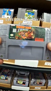 8.7K views · 5.3K reactions | Let's pack an order for Edward! Which donkey kong country game is your favorite? #oddlysatisfying #orderpacking #nintendo #nostalgia #retrogaming #letspackanorder #packingorders #Asmr | The Video Game Company | Facebook