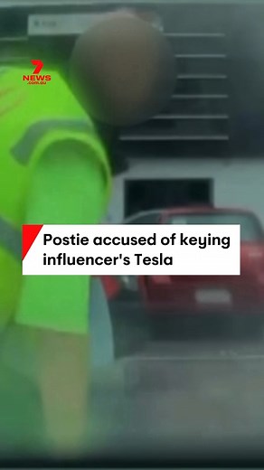 Australia Post has suspended a Gold Coast delivery man, accused of keying the bonnet of a Tesla, belonging to star influencer Ellie Gonsalves. Australia Post, and Police are investigating the incident. #Postman #Car #Tesla | 7NEWS Brisbane