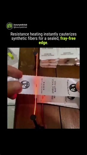 Luxury = Money & Power on Instagram: "Why precision manufacturing abandons blades for thermal energy. You are watching a rudimentary hot wire cutter utilizing the principle of Joule heating. As electrical current flows through a high-resistance Nichrome wire, the energy dissipates as heat, instantly reaching temperatures high enough to melt through synthetic polymers on contact. Unlike mechanical shearing (scissors), which crushes fibers and leaves open ends susceptible to unraveling, thermal cu