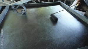 Painting of iron gates. Painting of metal gates with a roller.