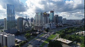 Interstate I-35 Monarch Highway peak hour busy traffic North downtown Austin, Texas Capital City near Colorado River, skyscraper, high-rise office building, hotels, condos metropolitan, flyover