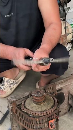 jaw bearing puller, also known as a pulley or gear puller, being used to remove a component shaf