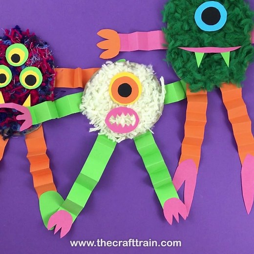 Heres a fun way to use up pom pom trimmings... fluffy yarn monsters! These guys are so cute and they make colourful Halloween decorations too | The Craft Train