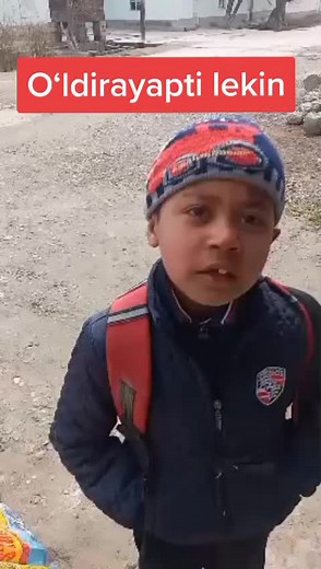 Exploring Rural Paths in a Blue Jacket and Red Backpack