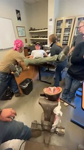 This man was demonstrating the dissection of a horse hoof at a Horseshoeing School. As he pulled on the demo hoof model, it came off the holder, causing the man to stumble backwards and fall onto a table. Luckily, he was caught by the students and seemed okay as everybody had a good laugh. | Jukin Copyright Management
