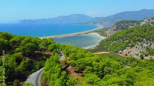 Loggerhead turtle spawning site Iztuzu Beach. It is known for its blue crab and golden sands. Next to Dalyan delta. Drone view from above valley of beach and mountains. Tourist place in Turzia.