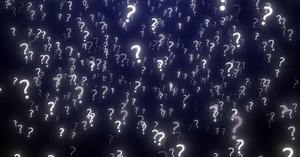 White Glowing Question Mark Flying On Dark Blue Background. Camera Moving Forward Into Question Mark