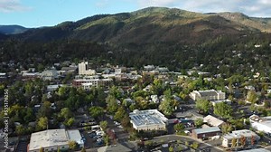 Ashland, Oregon, USA this is a drone shot of downtown. Facing South you can see downtown with the iconic Ashland Springs Hotel which is the tallest building.