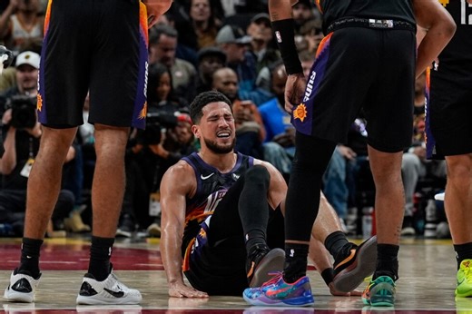 Suns All-Star guard Devin Booker to miss at least a week with sprained ankle