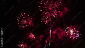 4K. loop seamless of real fireworks background, Fireworks display celebration, glowing fireworks show, Colorful New year's eve fireworks celebration