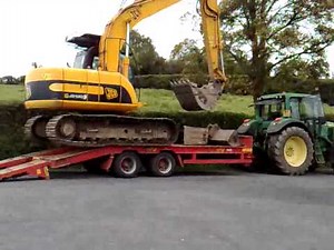 JCB 13t Track Excavator loading onto trailer