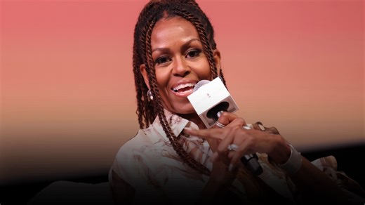 Michelle Obama looks chic in a knitted vest and jeans while giving relationship advice on podcast