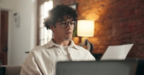 clip-4007568971-paperwork-laptop-man-reading-work-home-data