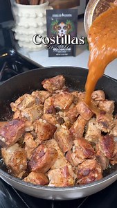 Pork Ribs in Chile Sauce In a skillet, add 3 pounds of pork ribs. Season with salt, black pepper, and 2 tablespoons of Spanglish Asadero Chili con Carne seasoning. Add 1/3 of an onion, 2 garlic cloves, 1 bay leaf, and 1 cup of water. Cover and let it cook for about 1 hour over medium-low heat. While the ribs are cooking, prepare the sauce. On a griddle or skillet, add 3 tomatoes, 8 tomatillos, 1/3 onion, 2 garlic cloves, and 1 serrano pepper. Roast until well charred on both sides, then remove. 