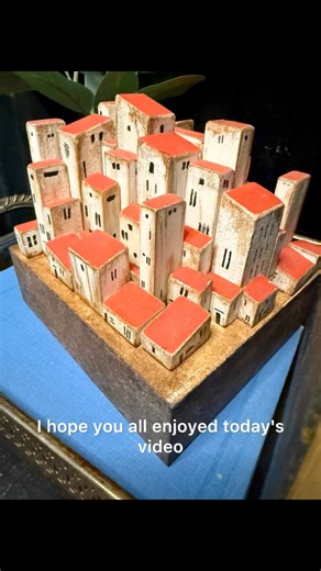 We crafted our own little village out of game pieces and scrap wood #diyhomedecor | Crafty Queens