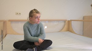 Disability a disabled child playing with her toys / Disability a disabled child playing with her toys with help from a special needs carer