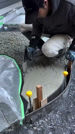the process of smoothing the cement mixture for making paths in the garden #construction #popular