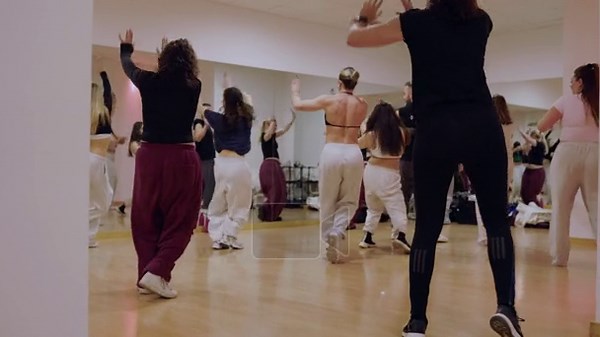 Energetic dancers practicing synchronized hip-hop moves together during a group class, following the instructor in a mirrored studio while learning a new choreography for a performance Stock Video Footage - Alamy