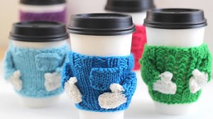 Quick Knit Gift Idea! These little Mug Cozy sweaters give your cup lots of personality, so let’s start knitting: https://www.studioknitsf.com/knitted-coffee-cozy-sweaters-holiday-gift-idea/ #StudioKnit #knitting #coffeecozy | Studio Knit