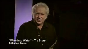 T. Graham Brown gives his heart felt insight on how the song "Wine Into Water" was written out of his own struggles with alcoholism. The song has since reached and spoke to thousands struggling with alcohol abuse or who know someone who is. T. received a recent GRAMMY Nomination for the 'Forever Changed' album (available in Cracker Barrel stores) which includes a new version of "Wine Into Water" with Jimmy Fortune. Listen as T gives an unplugged rendition of "Wine Into Water" accompanied by GRAM
