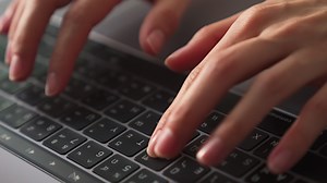 Download Close Up of Typing Hands for free
