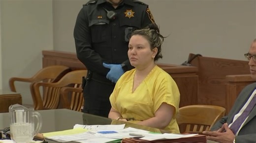 Woman accused of trying to hire man to kill cop ex remains jailed