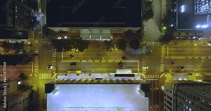 Top view of brightly illuminated street with driving cars in downtown district of Richmond in Virginia, USA. Traffic in modern American city