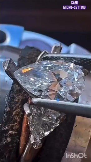 Pear-Cut Diamond Between Two Triangles | Precision Micro-Setting