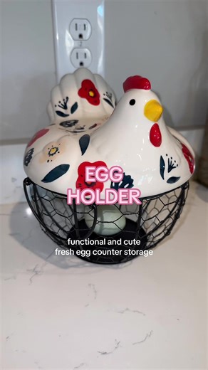 Farmhouse style kitchen decor that actually serves a purpose. This ceramic chicken egg basket is a functional countertop organizer with a cute rustic farmhouse aesthetic. The ceramic chicken lid sits on a metal wire basket that keeps eggs visible, ventilated, and easy to grab. Use it for eggs, produce, fruit, veggies, snacks, or as a farmhouse kitchen centerpiece. It fits perfectly into rustic kitchens, modern country kitchens, cottagecore homes, or farmhouse pantry styling.