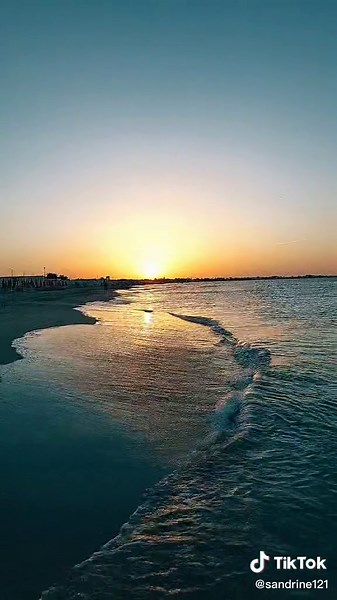 Stunning Beach Sunset Over Gentle Waves