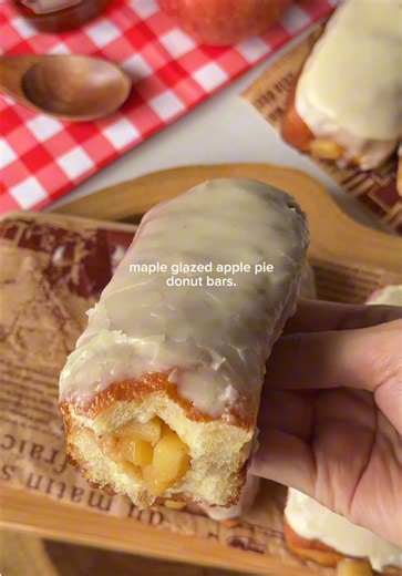 maple glazed apple pie donut bars🍎🍁🍩 Ingredients: Dough: 180ml (3/4 cup) warm milk 38g (3 tbsp) granulated sugar 6g (2 tsp) instant dry yeast 1 large egg 1 egg yolk 390g (3 1/4 cups) bread flour 1/2 tsp salt 55g (1/4 cup) unsalted butter, softened Apple pie filling: 2 large apples, peeled, cored, and diced 50g (1/4 cup) brown sugar 20g (1 1/2 tbsp) unsalted butter Squeeze of lemon juice 1/2 tsp cinnamon Dash of nutmeg 1/8 tsp salt 1 tsp vanilla extract 1 tbsp cornstarch 2 tbsp water Maple gla