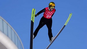 How does the scoring system work for Olympic ski jumping?