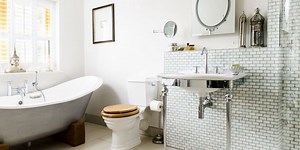 A glamorous slipper bath is the star of this vintage-style bathroom