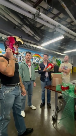 Jonas Brothers being gifted hand built Iron Man Masks backstage in Orlando! 📸: @robbiedoesthingz #JoeJonas #NickJonas #KevinJonas #Jonas #JonasBrothers | Follow @jonasdailynews_ for more. | Jonas Brothers Daily News