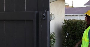 Smart meter technician calibrates electric meter.