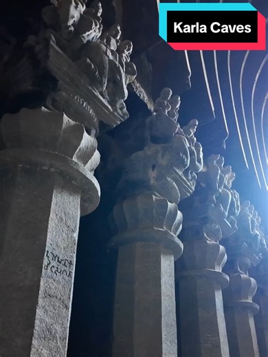 The Great Chaitya Hall of Karla Caves Carved deep into the basalt hills of western India, the Karla Caves represent one of the earliest and most ambitious examples of rock-cut Buddhist architecture. Excavated between the 2nd century BCE and the 5th century CE, the site is dominated by its monumental chaitya hall—a prayer space designed to echo the timber construction of earlier wooden structures. The tall octagonal pillars lining the hall are topped with sculpted capitals of humans, animals, and