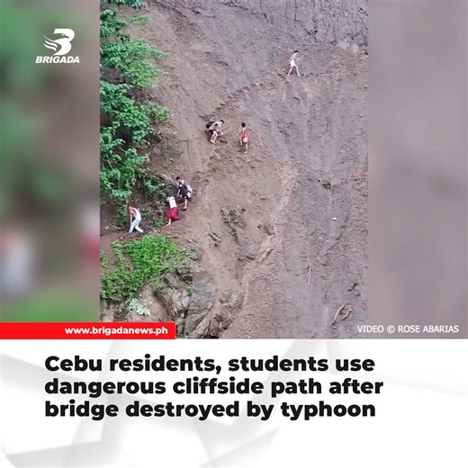Viral video shows residents and students in Talisay City, Cebu using a cliffside path after their bridge was destroyed by typhoon . The risky crossing above a rushing river sparked concern online. READ - https://www.brigadanews.ph/cebu-residents-students-use-dangerous-cliffside-path-after-bridge-destroyed-by-typhoon/ | Brigada News FM Kalibo