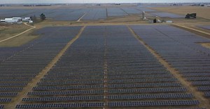 Large-scale solar farms are spreading, sparking debate over labor practices and land use