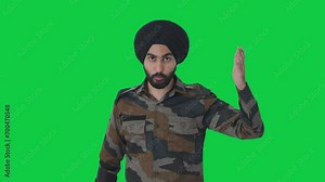 Angry Sikh Indian Army man shouting on someone Green screen