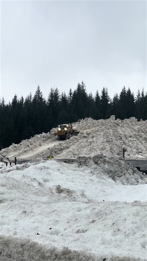 Dozer Operating on Snowy Mountain Terrain