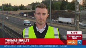 Crews working to clear overturned semi-truck off I-205