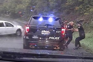 Officer makes incredible save, pushing colleague out of car's path in the nick of time