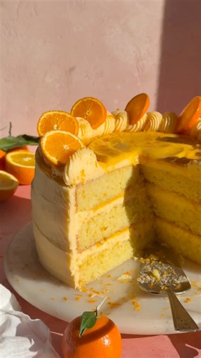 Celebrate winter citrus with my Orange Dreamsicle Cake! Vanilla orange cake layers are filled with luscious orange curd & silky orange cream cheese frosting! #layercake #cakedecorator #cakestyle #bakinglove | Blue Bowl