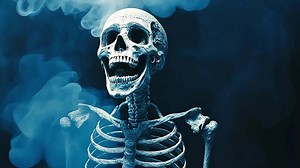 Download A human skeleton with a skull is surrounded by blue smoke. for free