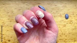 Close-up damaged ruined female gray brown shellac weak thin regrown nails,consequences of gel polish.Home manicure concept.Fashion salon beauty,Glitter nail womens polish scratches spoiled,4k footage